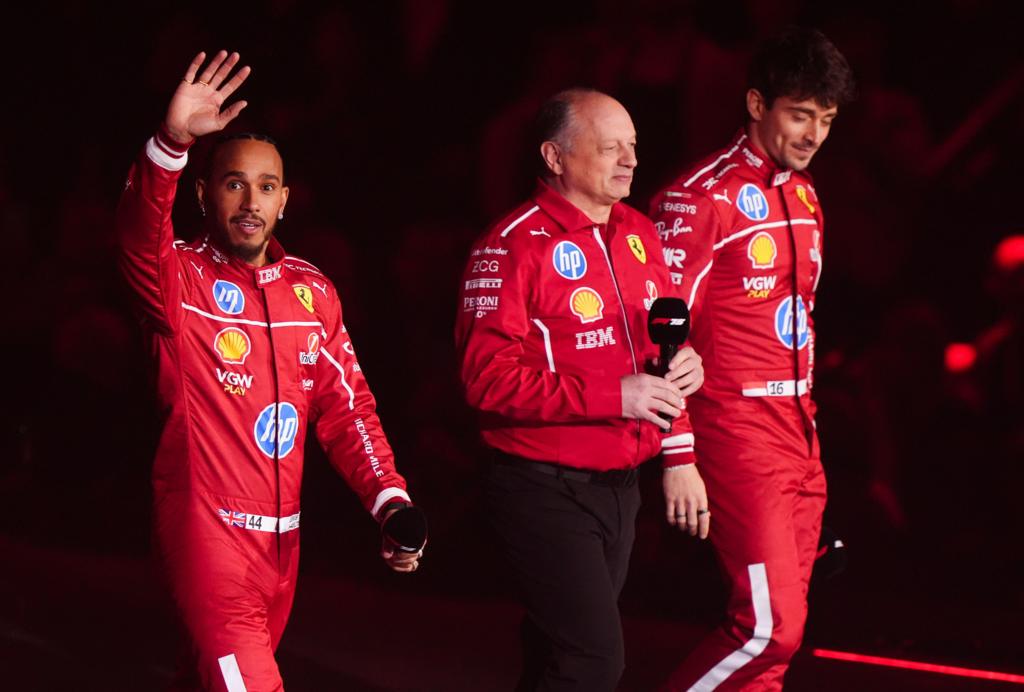 Lewis Hamilton, Fred Vasseur and Charles Leclerc walk on to the stage at the O2 Arena