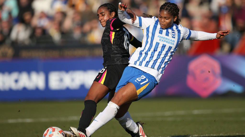 Naomi Girma and Madison Haley in action during the match at Broadfield Stadium