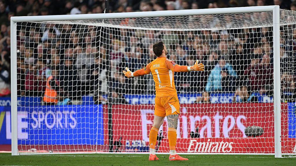 Lucas Perri of Leeds United celebrates after saving a penalty from Jarrod Bowen