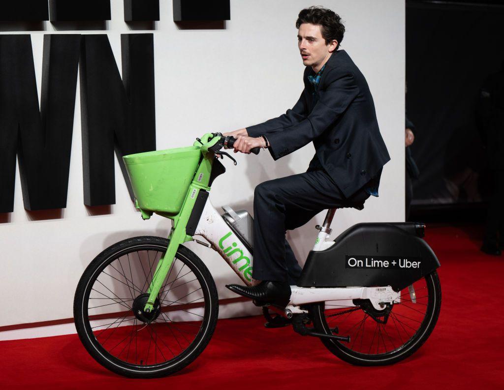 Timothée Chalamet arrives on a Lime Bike as he attends the UK Premiere of "A Complete Unknown" at the BFI Southbank on January 14, 2025 in London, England