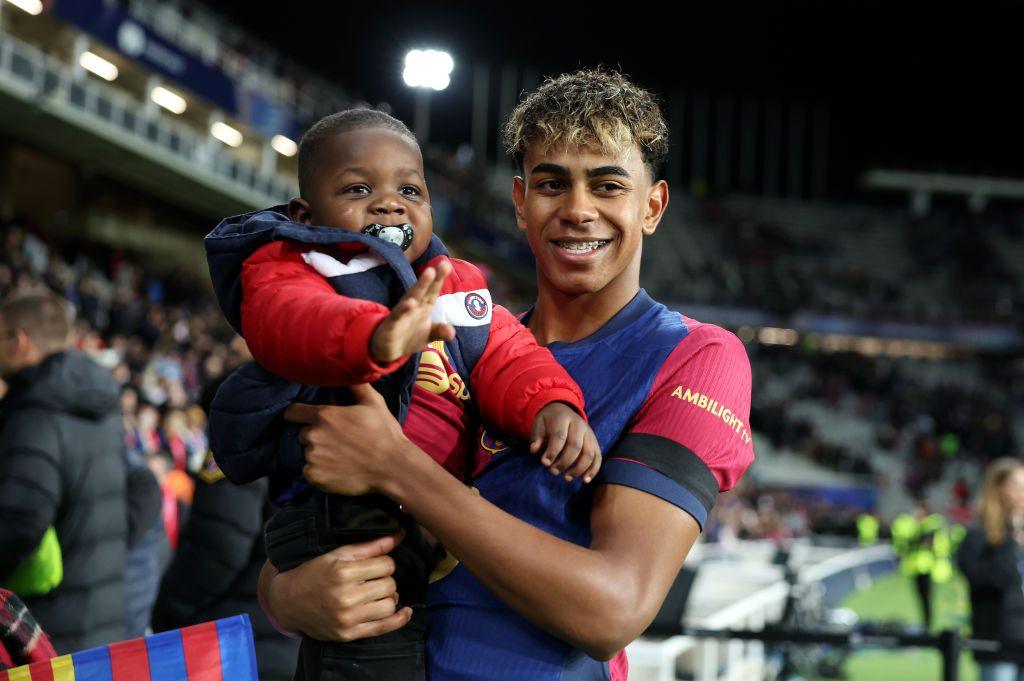 Lamine Yamal Barcelona celebrates victory while holding his brother after the UEFA Champions League 2024/25