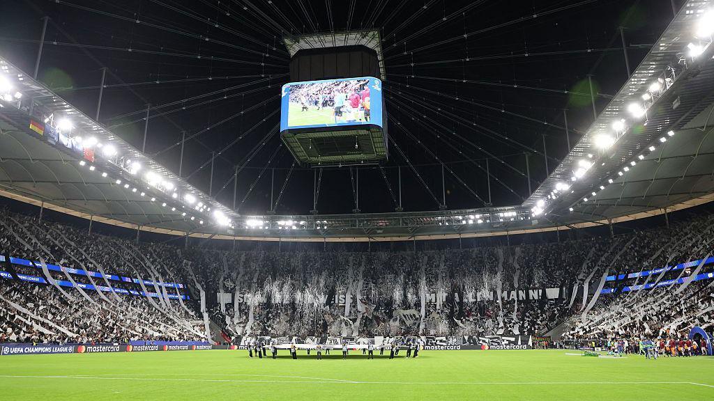 Home fans waved flags and released confetti at Deutsche Bank Park 