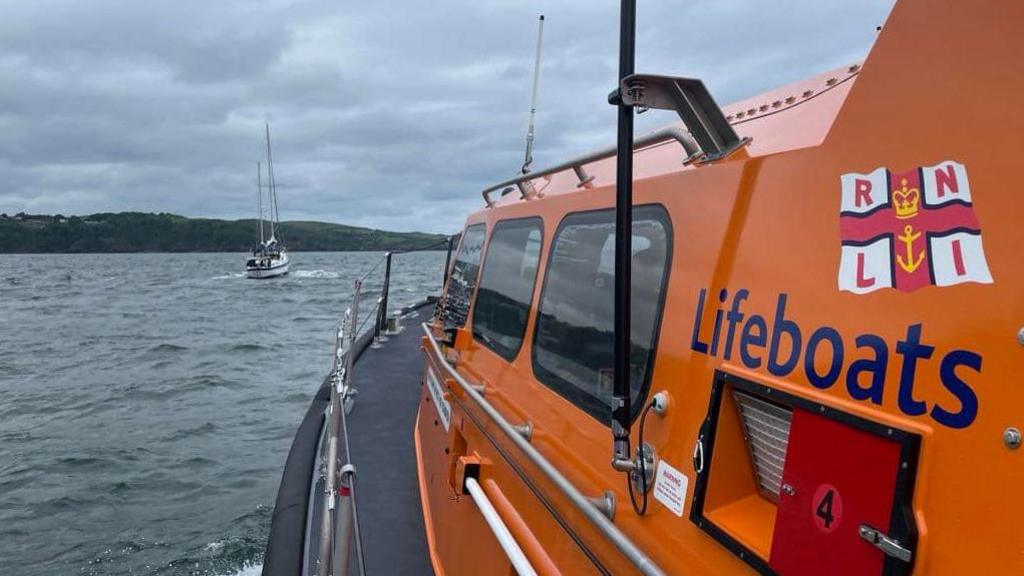 The lifeboat traveling towards the yacht in trouble just west of Foreland Point