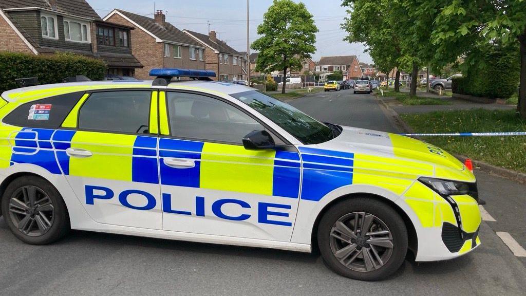 Police car at scene of stabbing in Ellesmere Port