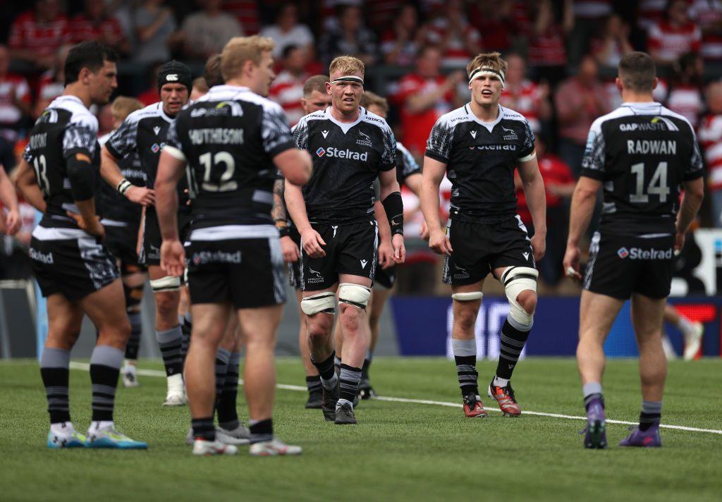 Newcastle Falcons players on the field away to Gloucester