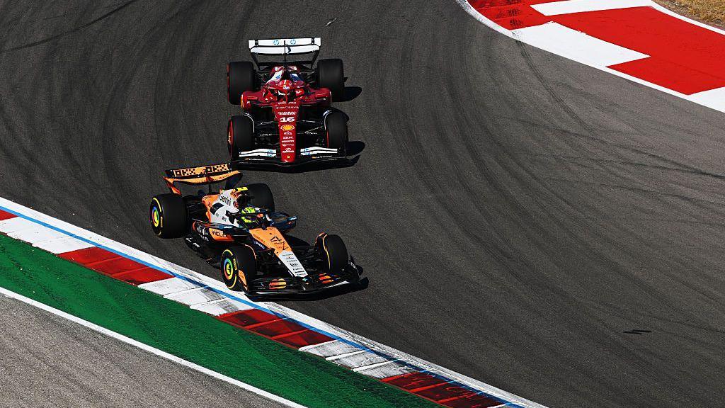 Lando Norris battling with Charles Leclerc on the track during the United States Grand Prix