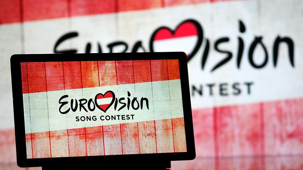Eurovision Song Contest 2026 in Austria logo is seen displayed on a tablet. 