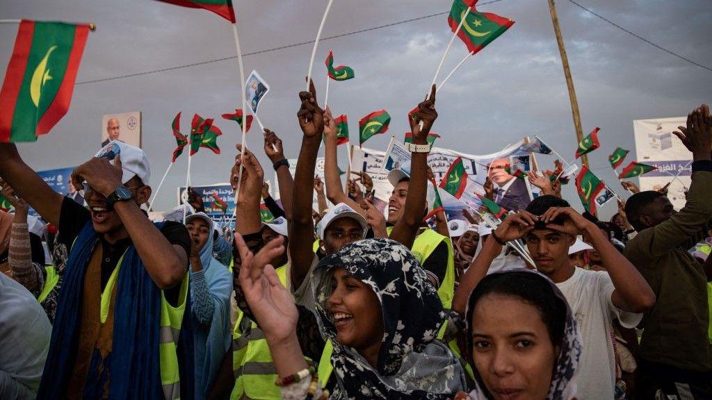 Mauritanians stand in a political rally ahead of the presidential elections