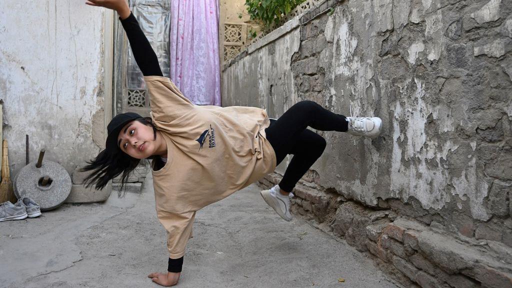 In this photo taken on June 12, 2021, Manizha Talash, the only female member of a group of breakdancers comprised of mostly Hazara boys, practices a move in Kabul