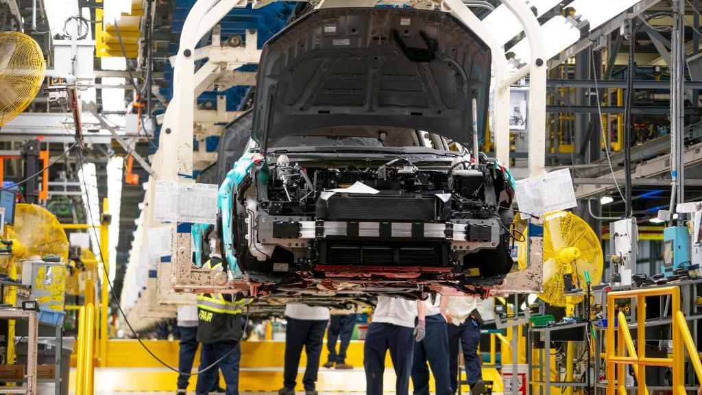 Workers continue vehicle assembly shortly before the line was shut down for an event at the Honda of Canada Manufacturing Plant 2 in Alliston, Ontario