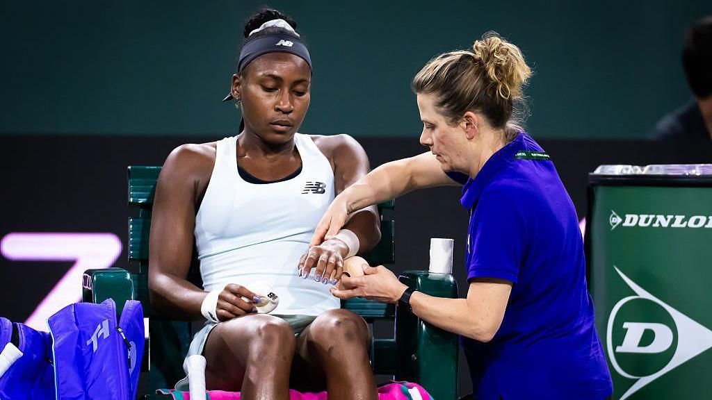 Coco Gauff receives treatment during a medical timeout 