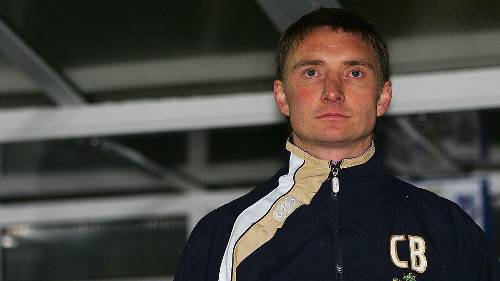 Chris Brass looks on