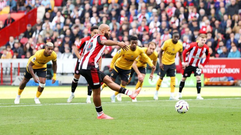 Bryan Mbeumo scores a penalty in Brentford's Premier League match against Wolverhampton Wanderers