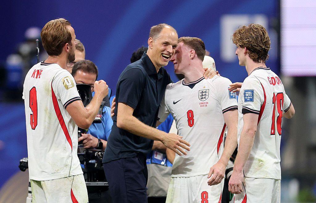 Thomas Tuchel embraces England players at the end of a World Cup game.