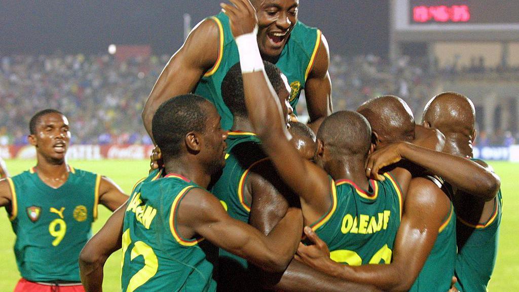 Cameroon celebrate in sleveless shirt at Africa Cup of Nations 2002