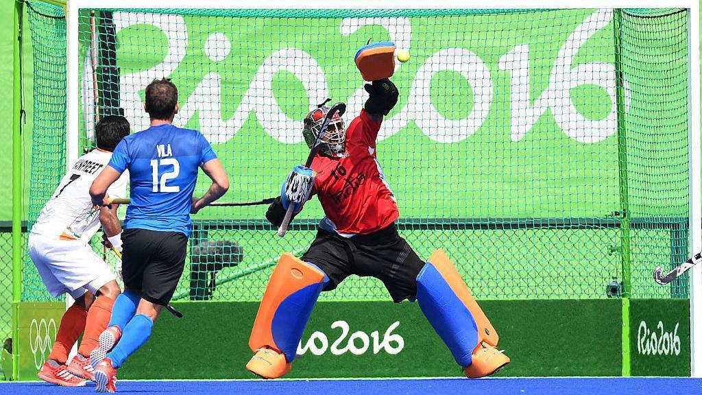 India's Sreejesh Parattu stops a shot on goal during the men's field hockey Argentina vs India match of the Rio 2016 Olympics Games at the Olympic Hockey Centre in Rio de Janeiro on August, 9 2016. / AFP / MANAN VATSYAYANA (Photo credit should read MANAN VATSYAYANA/AFP via Getty Images)