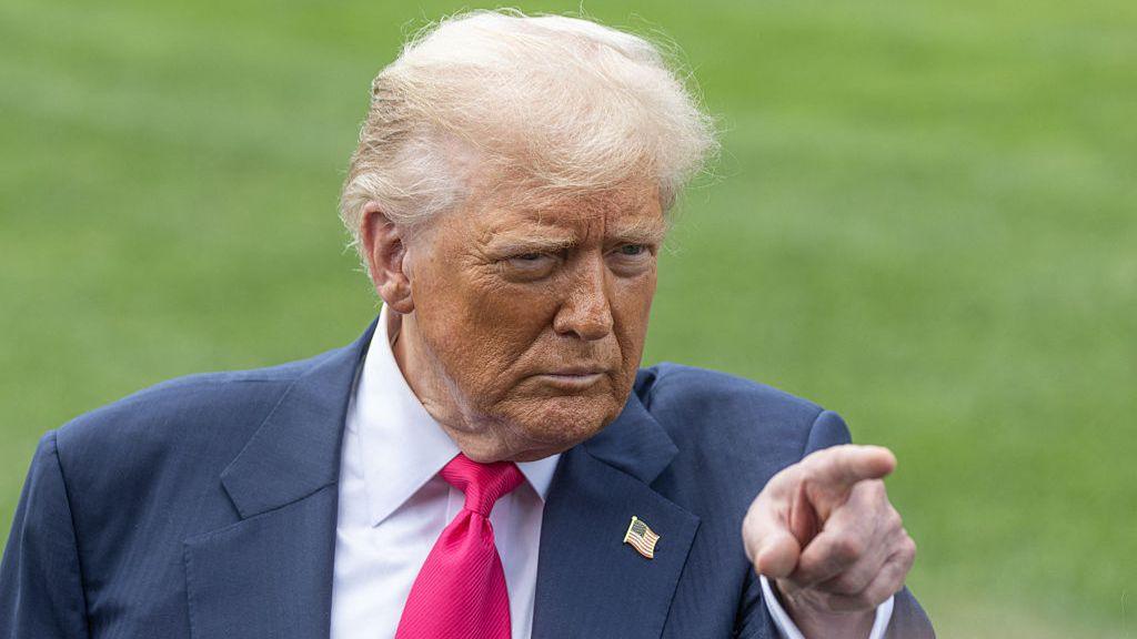 US President Donald Trump speaks with members of the media before boarding Marine One on the South Lawn of the White House on 15 July 2025.