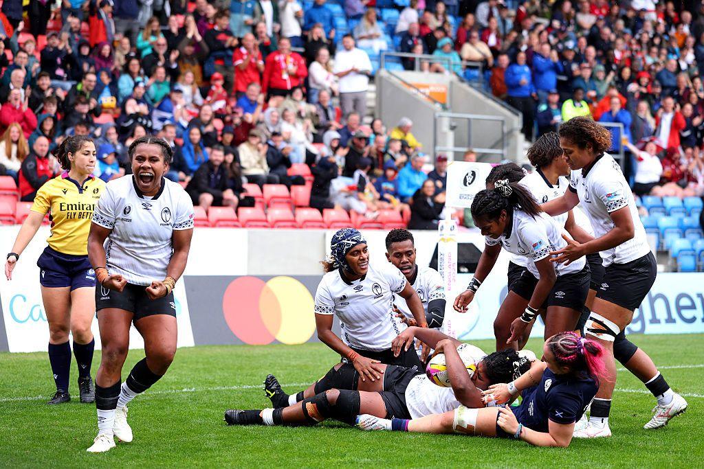 Fiji celebrate scoring a try against Scotland