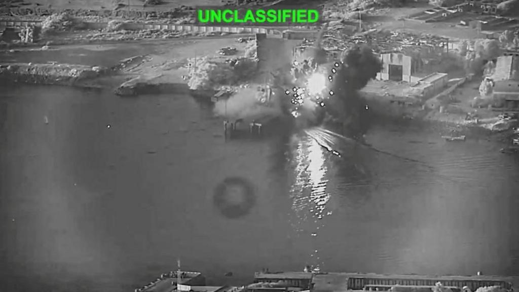 Smoke rises after a U.S. one-way attack surface drone reached its target, a submarine and ship maintenance facility according to U.S. Central Command, in Bandar Abbas, Iran, in this screengrab taken from a video, which was released July 13, 2026