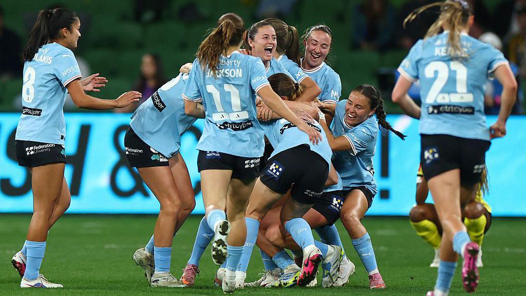 Danielle Turner, Laura Hughes and Bryleeh Henry of Melbourne City celebrate winning the A-League Women Grand Final against Wellington Phoenix 
