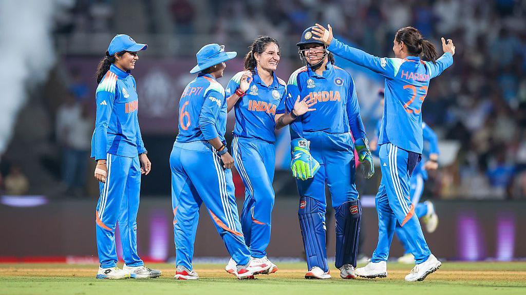 Renuka Singh Thakur and other members of India's women cricket team celebrate in the field