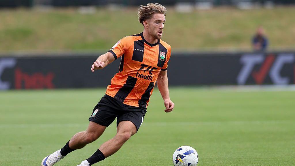 Ryan Glover on the ball for Barnet