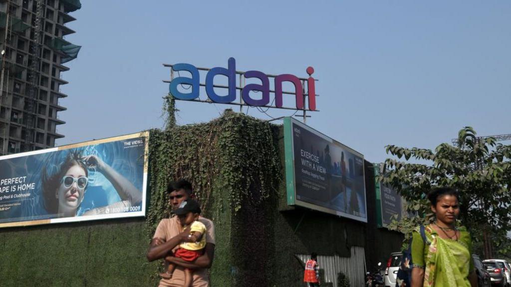 Signage for Adani Group at the construction site of an Adani Realty residential project in Mumbai, India, on Thursday, Nov. 21, 2024. 