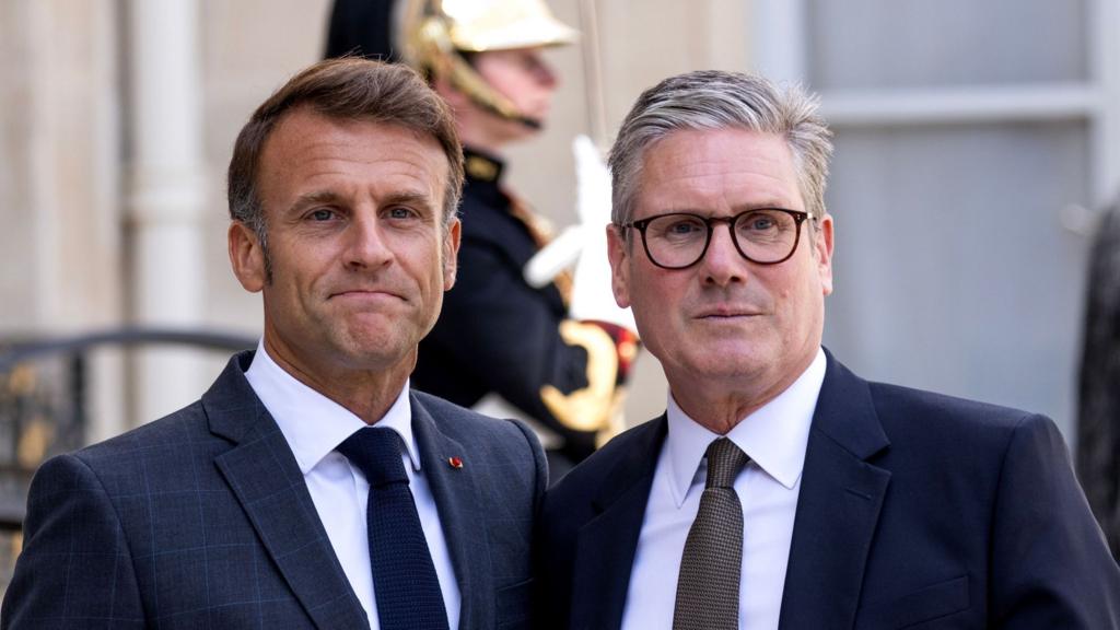 French President Emmanuel Macron poses with British Prime Minister Keir Starmer during his visit to the Elysee Palace in Paris