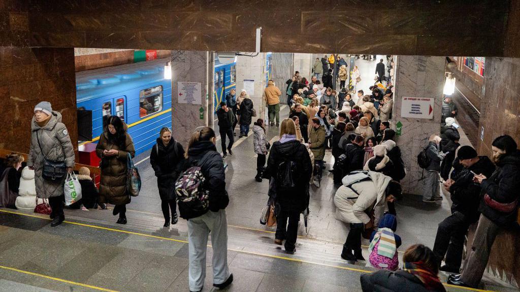 An image of a Metro station in Dnipro with people sheltering inside