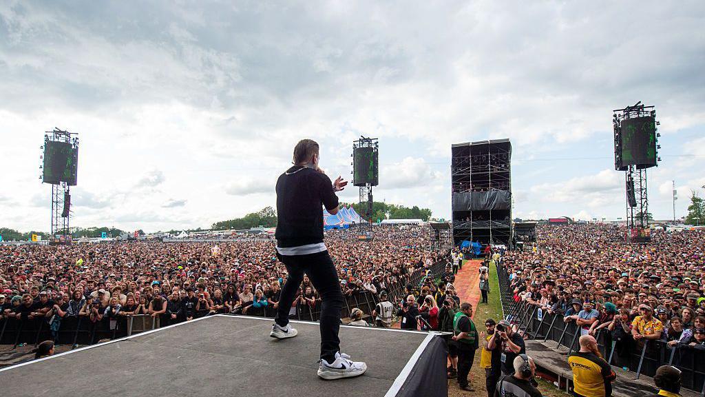 A view from the stage as Brent Smith of Shinedown performs to the crowds at Download Festival at Donington Park