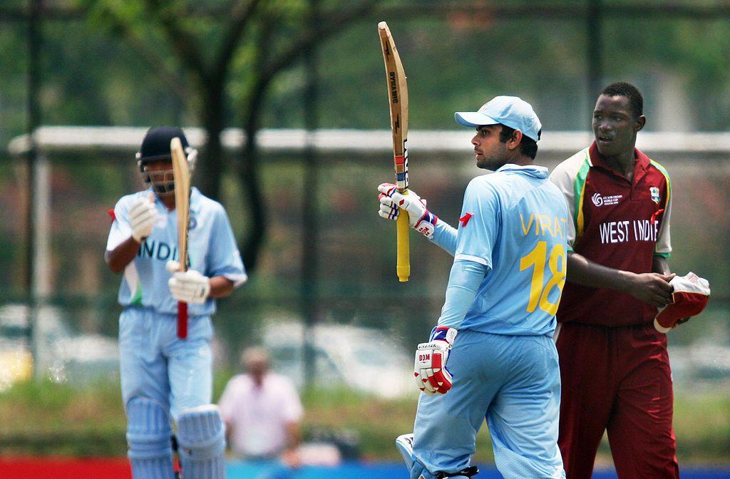 Indian Captain Virat Kohli celebrates his century against the West Indies in the last qualifying match at the Kinrara Cricket Oval in Kuala Lumpur on February 22, 2008.