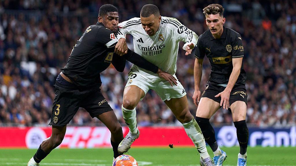 Cristhian Mosquera battles with Real Madrid forward Kylian Mbappe