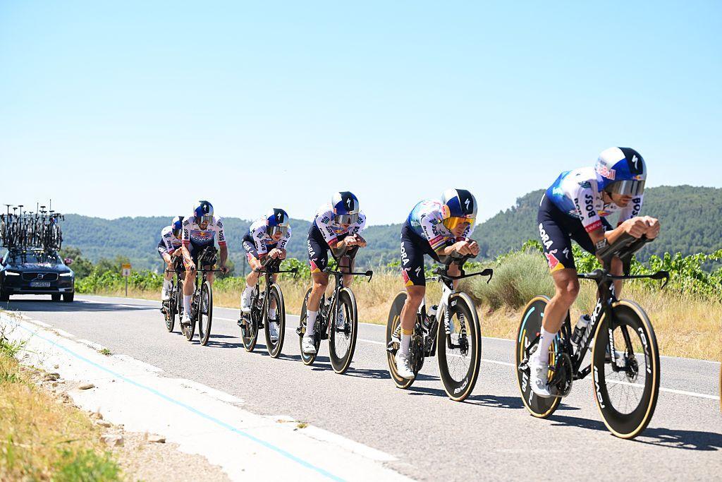 Red Bull-Bora-Hansgrohe riders take part in a time trial practice, with six riders in a single-file row