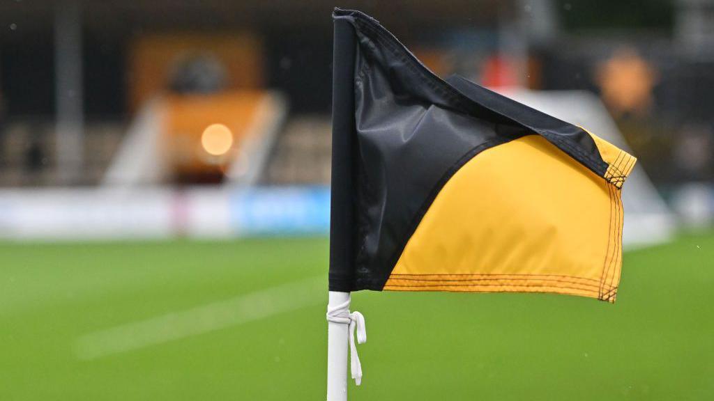 A corner flag at Cledara Abbey Stadium