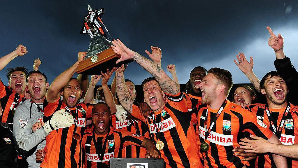 Barnet players celebrating winning the National League in 2015