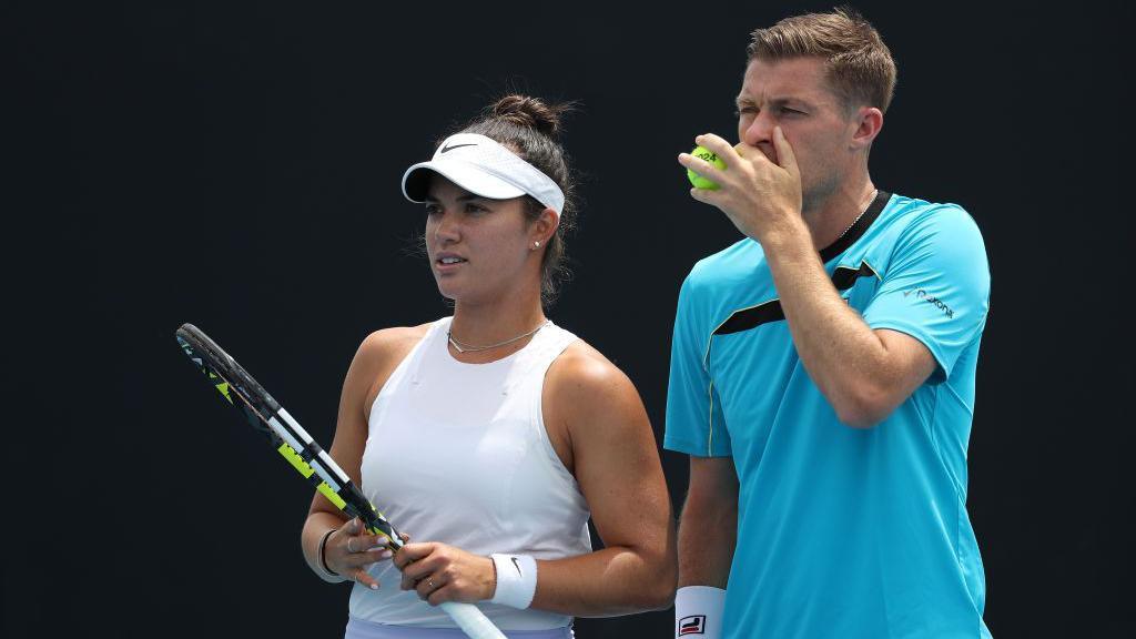 Desirae Krawczyk and Neal Skupski stand side-by-side