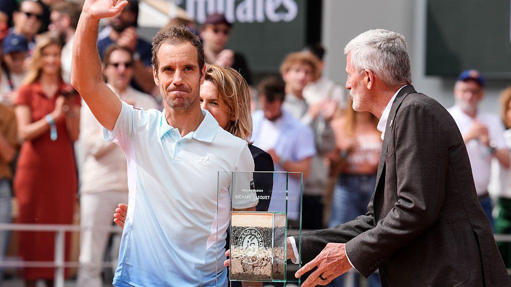 Richard Gasquet waves to the crowd during his farewell ceremony