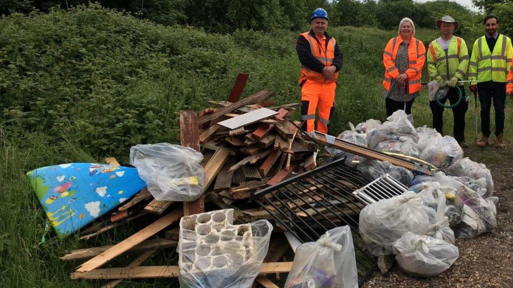 Walsall litter pickers with the fruits of their labour in Mill Street, Blakenall