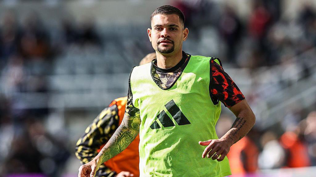 Bruno Guimaraes of Newcastle United participates in the pregame warmup session during the Premier League match between Newcastle United and West Ham United at St. James' Park