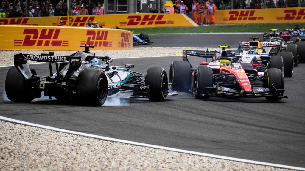 The Mercedes of George Russell spins out of the race after colliding with Ferrari's Lewis Hamilton on the first lap of the Belgian Grand Prix