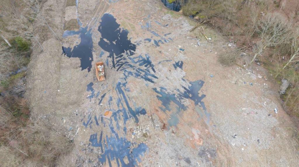 An aerial shot of a cleared woodland site covered in waste