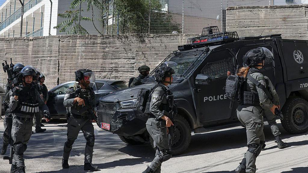 Israeli security forces deploy outside an Unrwa school in Shuafat refugee camp in Israeli-annexed East Jerusalem (8 May 2025)