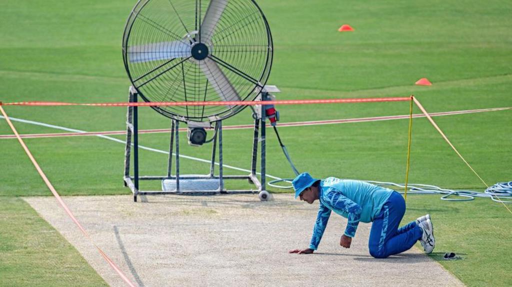 Noman Ali inspects the Rawalpindi pitch