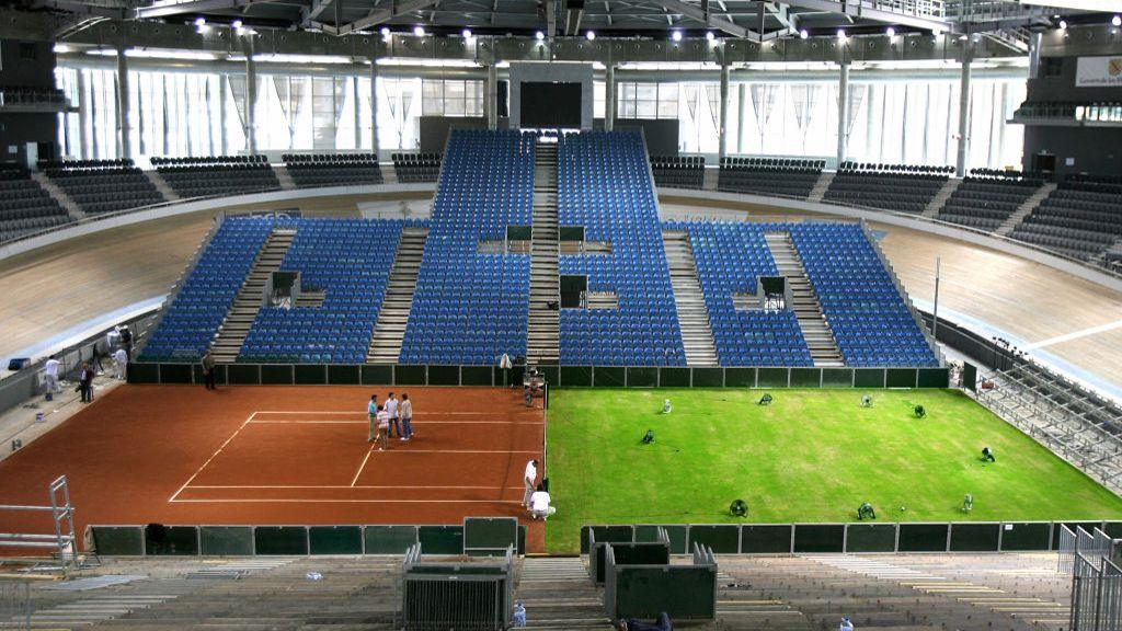 Half-clay, half-grass court being prepared.