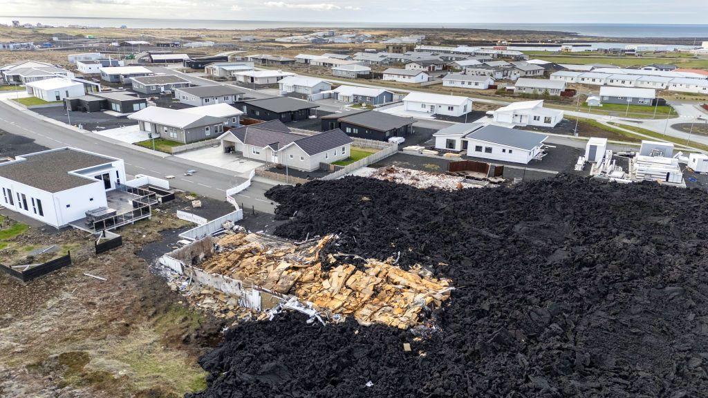 cooled lava flows into the town of grindavik destroying some houses.