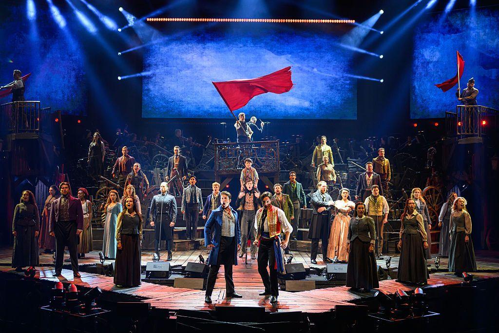 Les Mis cast on stage in costumes, performing