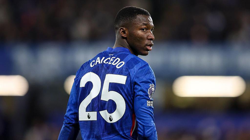 Moises Caicedo looks over