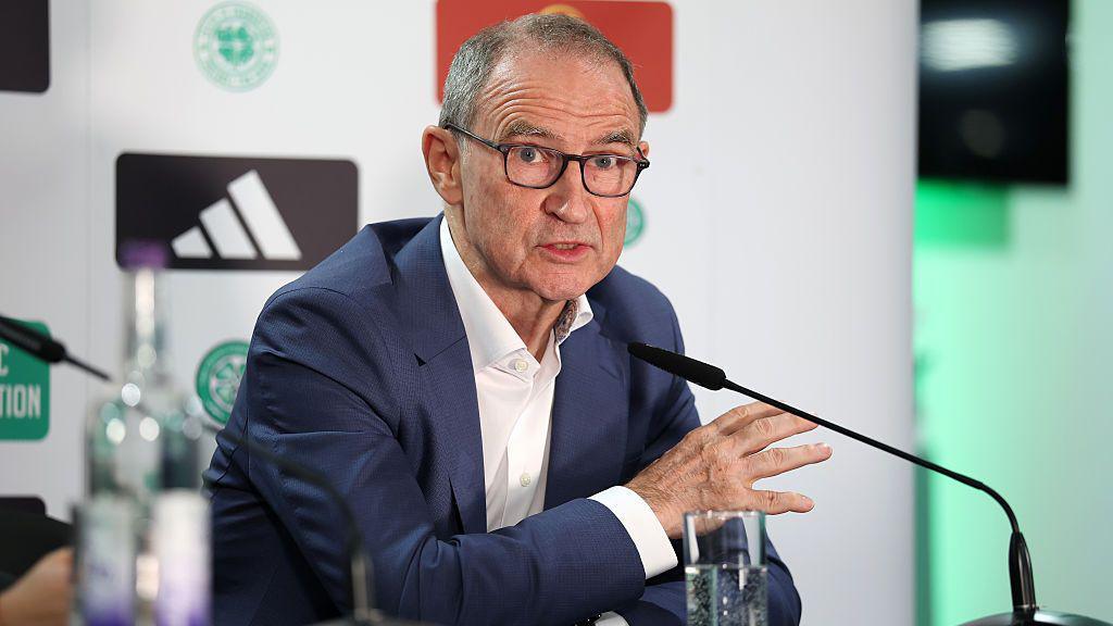 Martin O'Neill speaks into a microphone