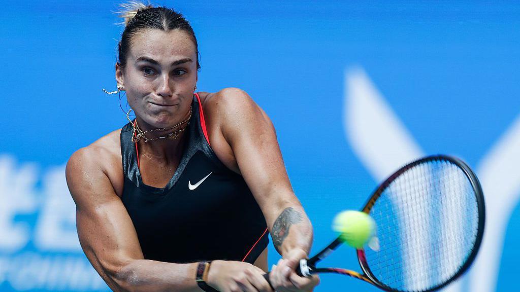 Aryna Sabalenka strikes a tennis ball at the Wuhan Open 