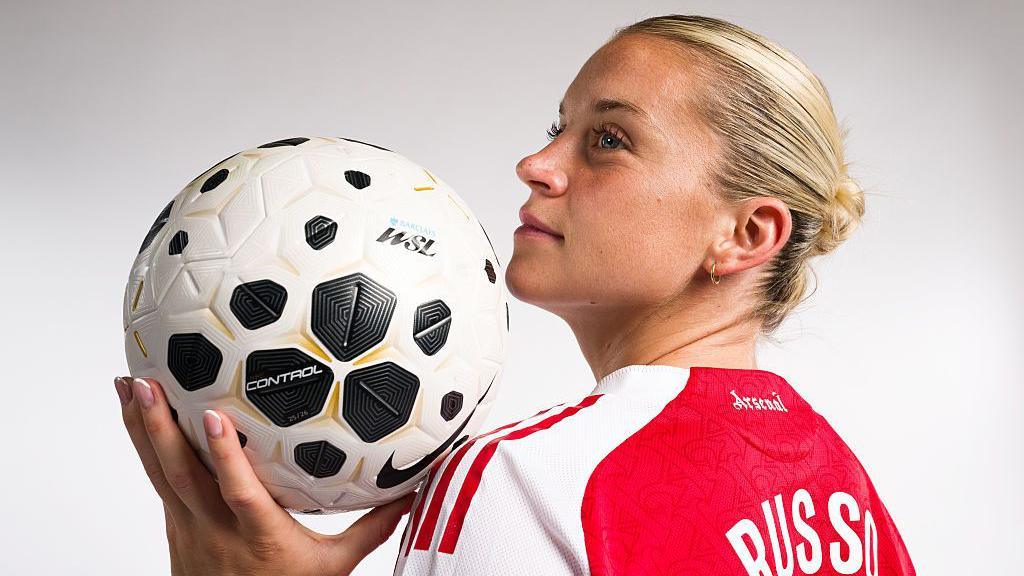 Alessia Russo poses with the new 2025-26 WSL match ball